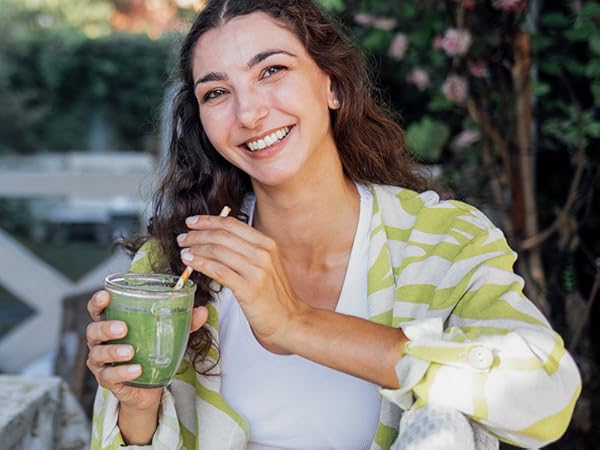 BulkSupplements NAC Capsules woman sipping green smoothie