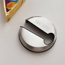 Vintorio Wine Foil Cutter and a piece of cheese