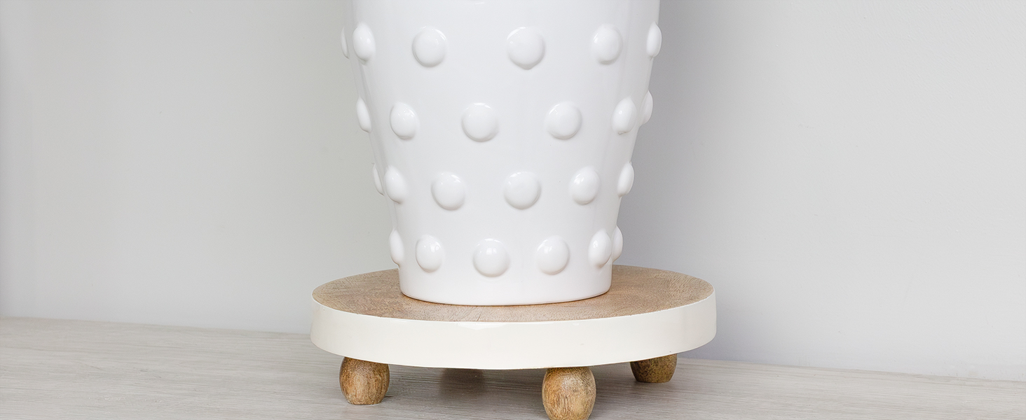 Close-up of vase surface showing hobnail texture; soft lighting to highlight detail.