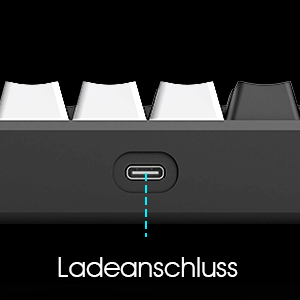 Close-up of electronic device interface. Dark background with illuminated blue icon or text. Label 'Ladeanschluss' visible below, suggesting charging-related function.