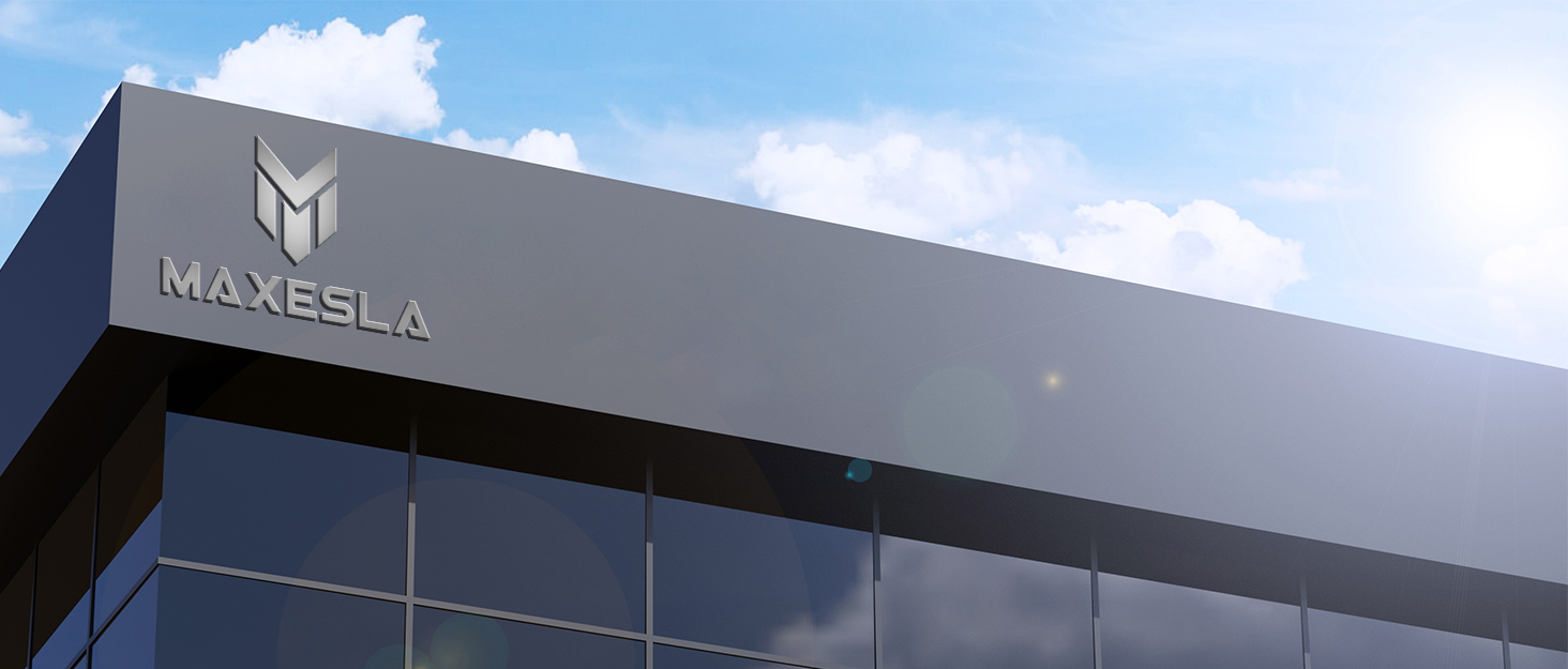 a modern office building with a blue sky and clouds