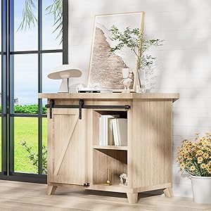 Rustic wooden sideboard with sliding barn door, open shelf, and decorative items on top including a framed world map and plant.