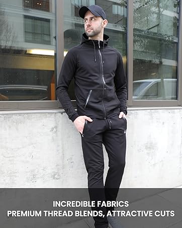 person feeling the fabric of black sweatpants men