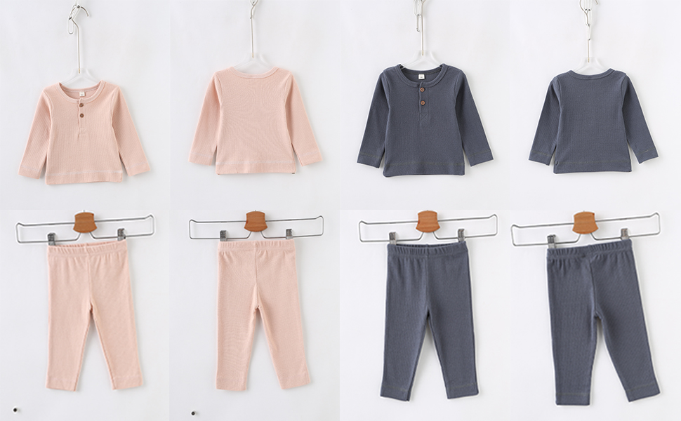 Two sets of pink and navy blue baby ribbed tops and trousers sets