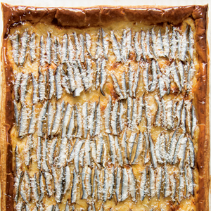 A photograph from World Food: Paris of Puff Pastry with Salt-Packed Anchovies. 