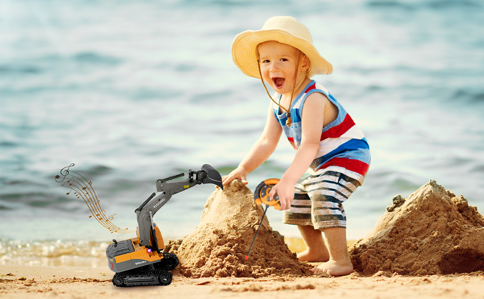 a little boy playing with a sand castle on the beach