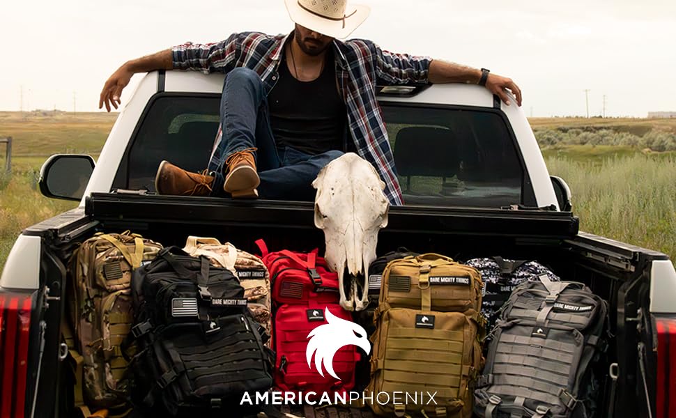 A cowboy sitting at the back of a truck surrounded by AMERICANPHOENIX backpacks