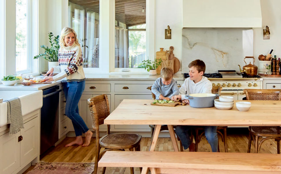 Interior photo of Jenny and children in kitchen