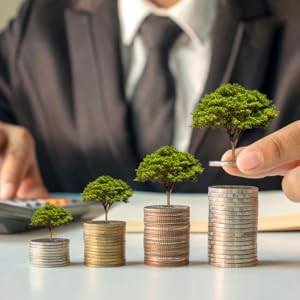 Stacks of coins with trees showing growth