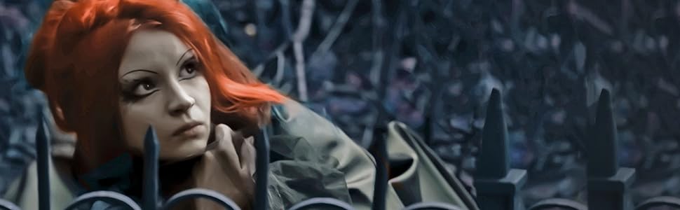 An image of Rapunzel with bright red hair, crouching behind an iron fence and looking upward.
