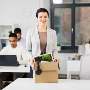 How to Set Up and Run a Successful Airbnb Business: Outearn Your Competition with Skyrocketing Rental Income and Leave Your 9 to 5 Job Even If You Are ... Hosting & Real Estate Investing Strategies) 8 Woman packing up her desk after quitting.