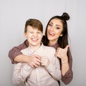 Happy mom and child hugging and holding hands