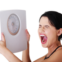 woman with weight scale