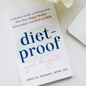 Diet Proof book next to laptop