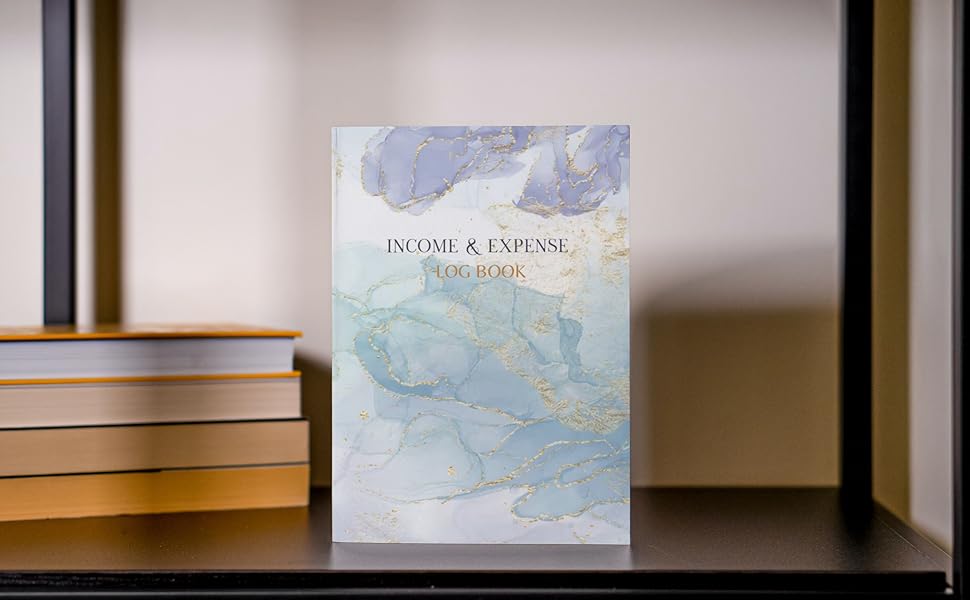 Income and Expense Log Book on a shelf with other books