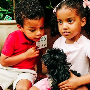 Boy and girl reading the word "dog"