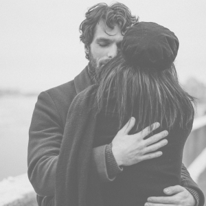 Man hugging a woman in reconciliation