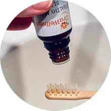 2. Invert bottle over toothbrush