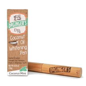 Dr. Ginger's Coconut Oil Whitening Pen laying horizontal next to its standing packaging box.
