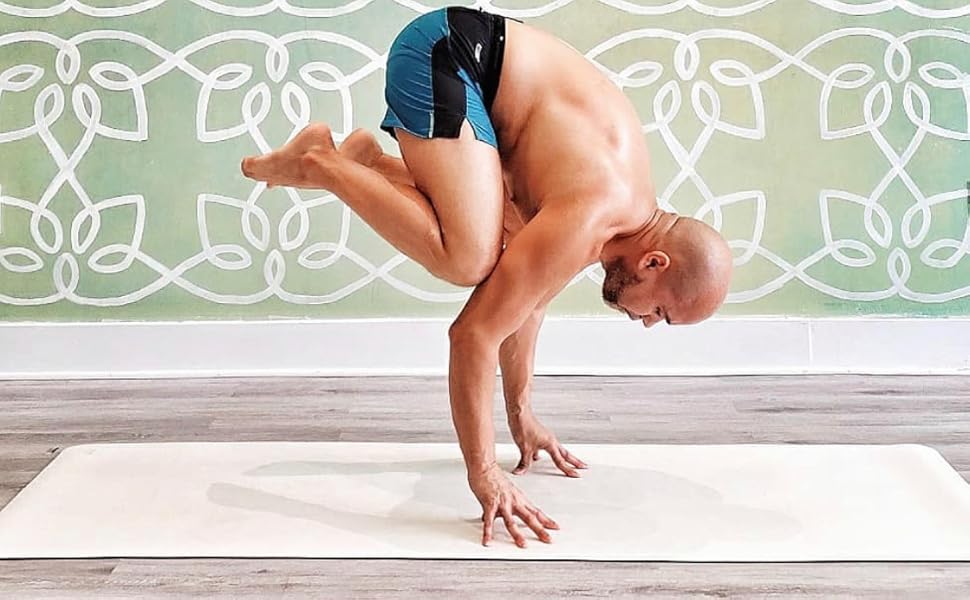 crow pose white yoga mat