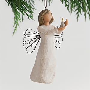 Willow Tree Angel of Hope ornament holding candleholder with small gold-flamed candle in her hands.