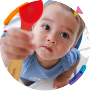 baby infant toddler playing with fun bright colorful red green blue bamboo spoons interest mealtime