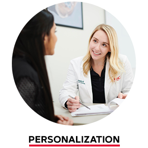 GNC scientist talking with another woman. Personalization.