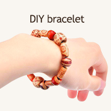 A collection of pure wooden beads in various shapes for free jewellery-making.