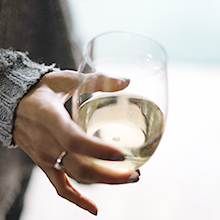 white wine in shatterproof wineglass stemless