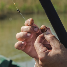 Fisherman Puts Worm On Hook