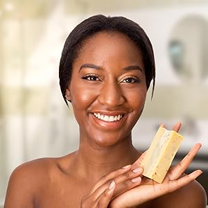 satisfied customer holding cinnamon latte soap