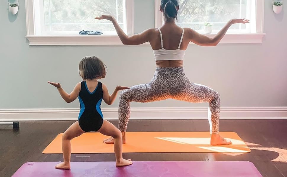 mother and daugther goddess pose yoga mat