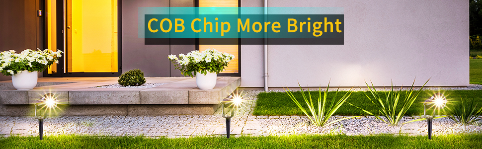 Grey waterproof outdoor plug for lighting highlighting backyard doors.