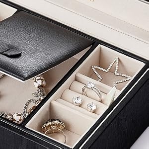 It holds either small or larger jewelry with removable division.