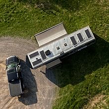 Large travel trailer with solar on the roof.