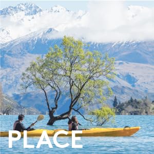 Couple Kayaking on the beautiful Lake Wanaka admiring the diverse scenery of New Zealand