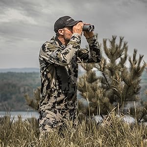 Hunter looking through the Bushnell Engage DX Binocular