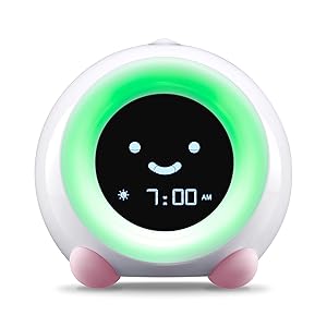 Blush Pink MELLA Sleep Trainer on Wake Mode with Green Light