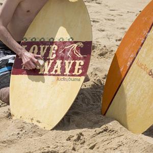 lucky bums wooden skim board water