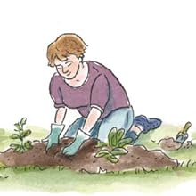 a woman plants seedlings in a garden