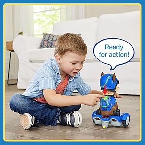 Kid presses green backpack button on the back of Chase. Chase says: Ready for action!