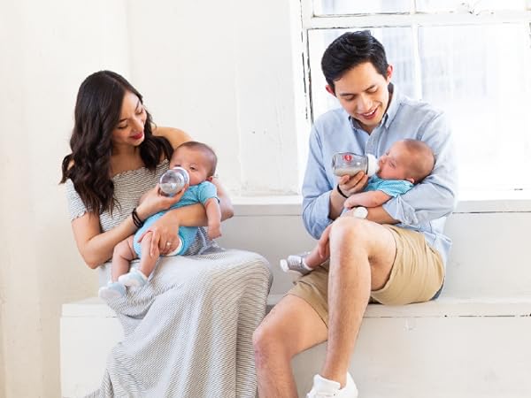 two parents feeding with boob ppsu baby bottles with twin babies 