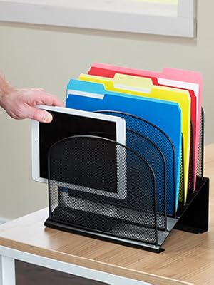 person adding tablet computer to organizer