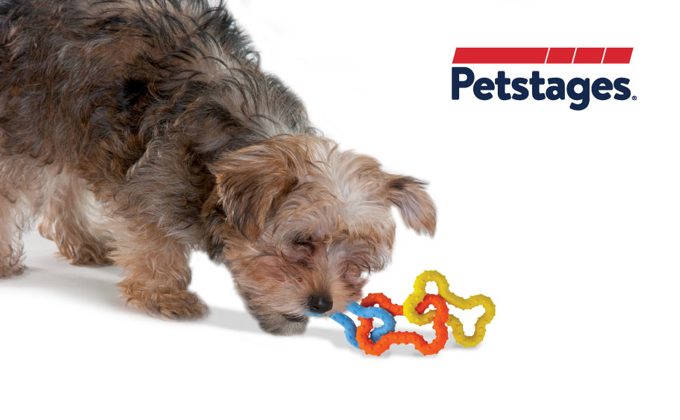 dog chewing on petstages dental and teething chew toys