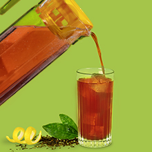 A pitcher of iced tea being poured into a glass