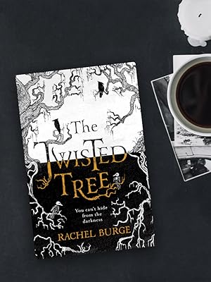 Lifestyle image of the twisted tree next to candle and cup of coffee