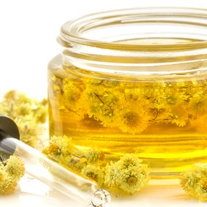 Stock herbs in oils jar with dropper image