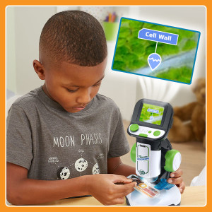 Kid viewing slide. Call out reads “Cell Wall”.