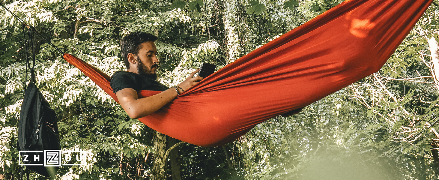 Young male in a hammock enjoying life thanks for Zhou's Thyroid Support