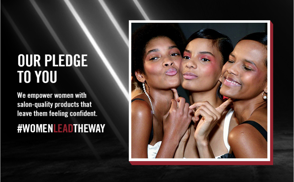 Three diverse, happy women posing together